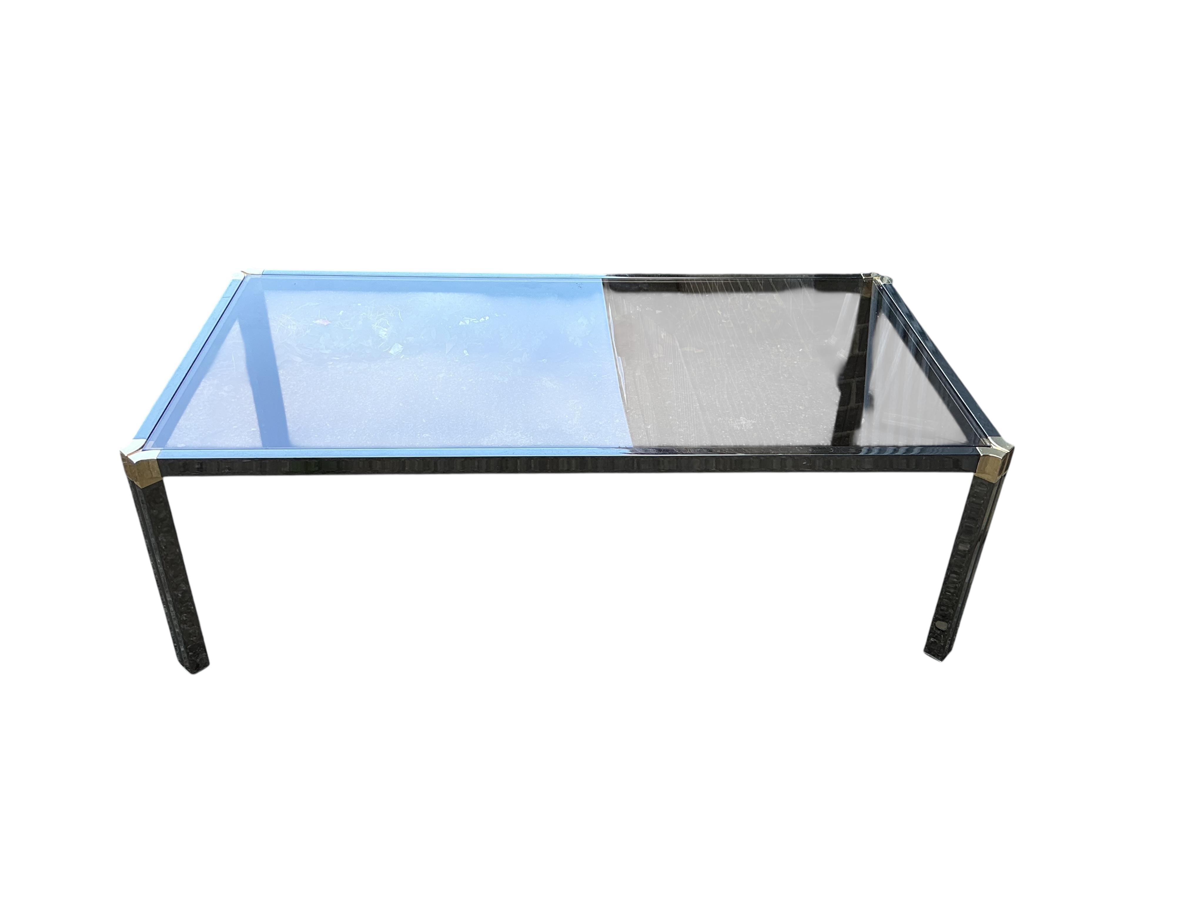 A Pierre Vandel rectangular glass top coffee table. Width 115cm, depth 60cm, height 37cm.